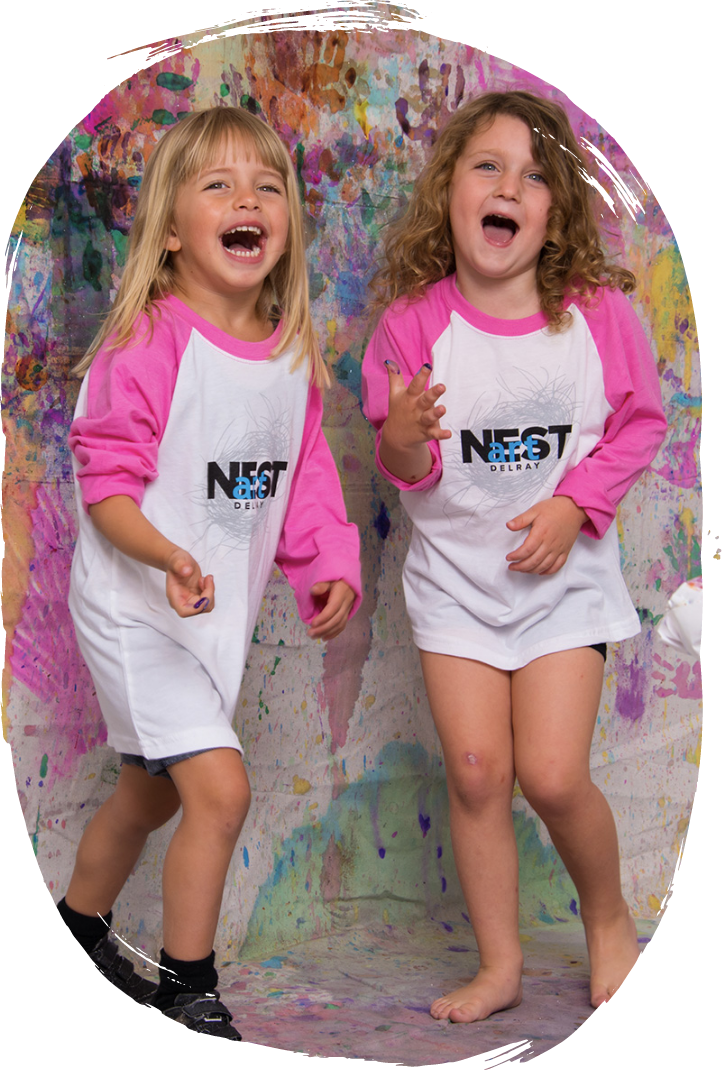 Child creating clay sculpture during camp