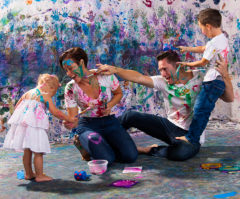 Student showcasing colorful artwork at Artnest Studio