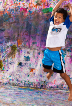 Teacher leading an engaging art project with kids at Artnest Studio