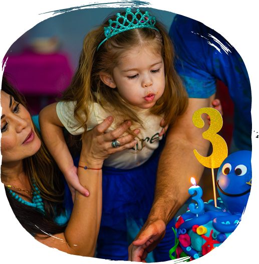 Birthday child holding painting at Artnest party