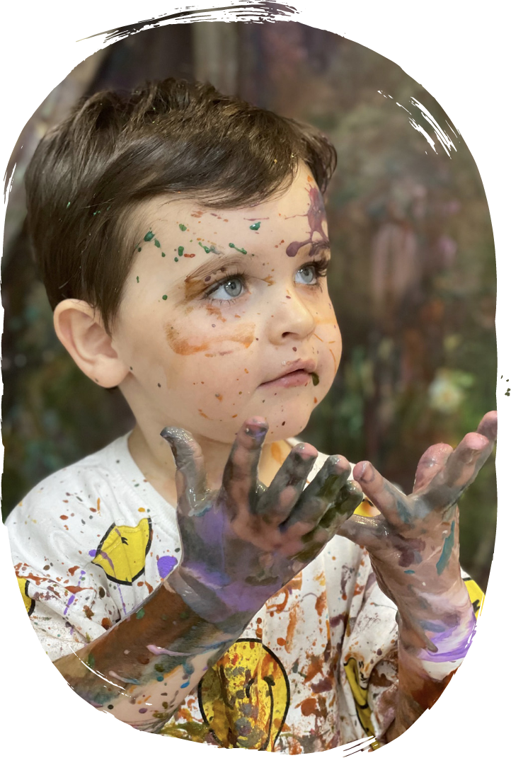 Creative gallery wall featuring student artwork at Artnest Studio